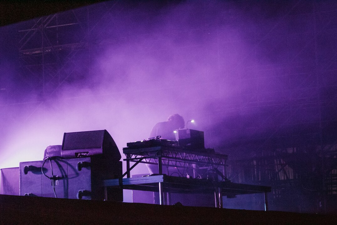 Concert stage with colorful lights and fog at night