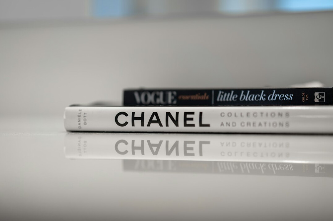 Stack of glossy fashion magazines on a table